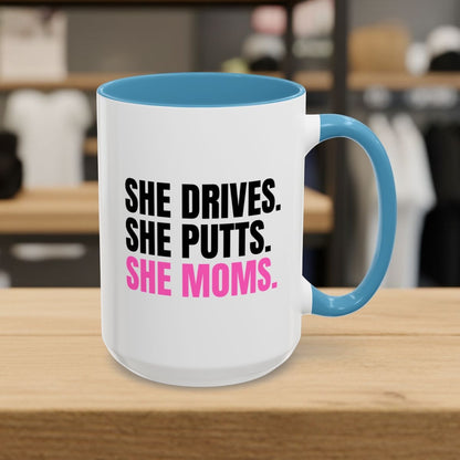 SHE DRIVES. SHE PUTTS. SHE MOMS. - Golf Mug in Light Blue