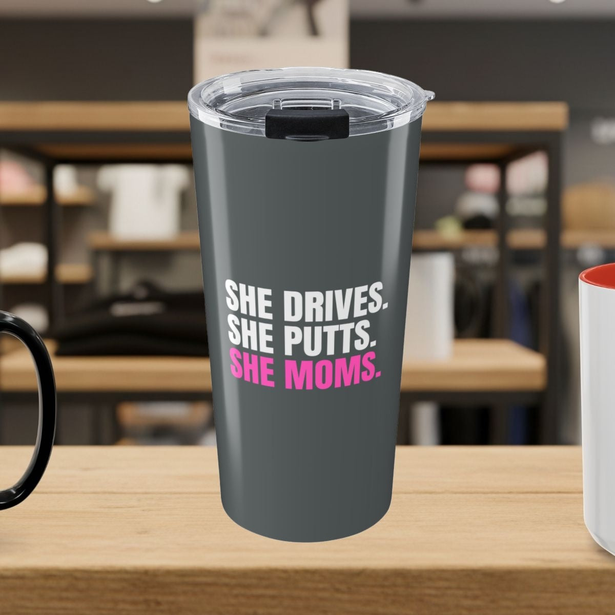 SHE DRIVES. SHE PUTTS. SHE MOMS. - 20oz Tumbler in Dark Grey