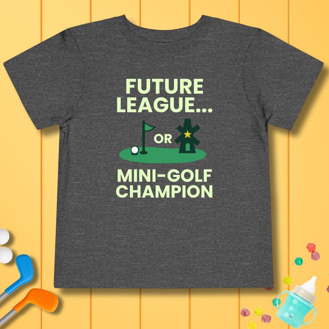 Future League… or Mini-Golf Champion - Funny Toddler Golf T-Shirt in Dark Heather Grey, great for casual wear. Find more fun golf focused products at oneforetheages.com