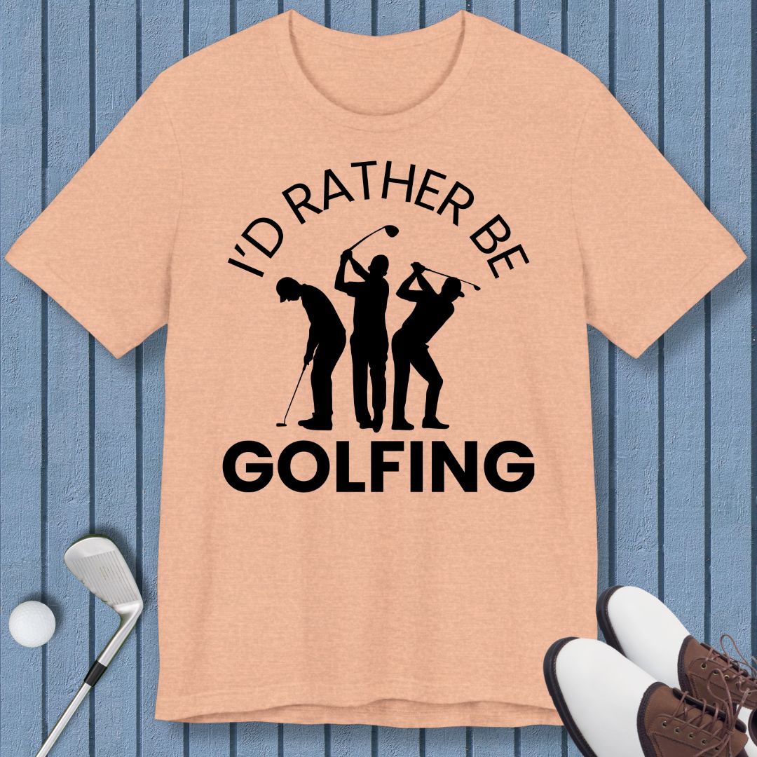 I'd Rather Be Golfing – T-shirt in Heather Peach, great for casual wear. Find more fun golf focused products at oneforetheages.com