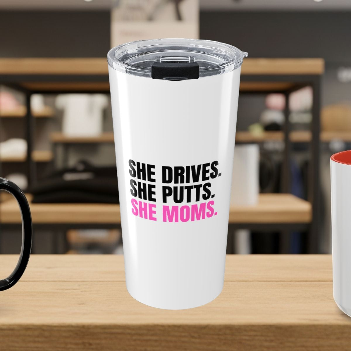 SHE DRIVES. SHE PUTTS. SHE MOMS. - 20oz Tumbler in White